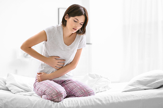 Woman experiencing abdominal pain